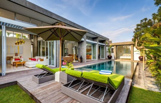 Villa Bamboo swimming pool and sunbeds with view of interiors