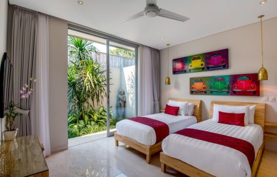 two single beds with garden view