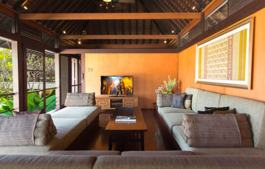 Lounge area of villa with couch and flat screen tv