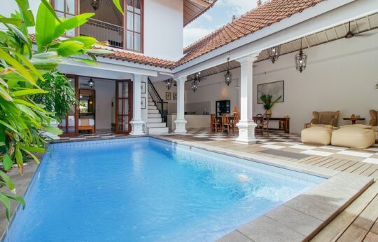 Villa Kailysa Indah Seminyak swimming pool and living area views with garden on side