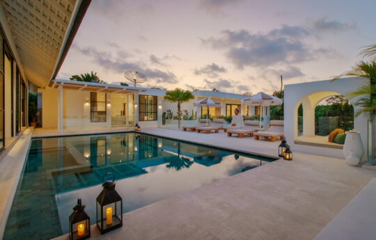 Villa Yang at sunset with swimming pool, pool deck and gazebo area