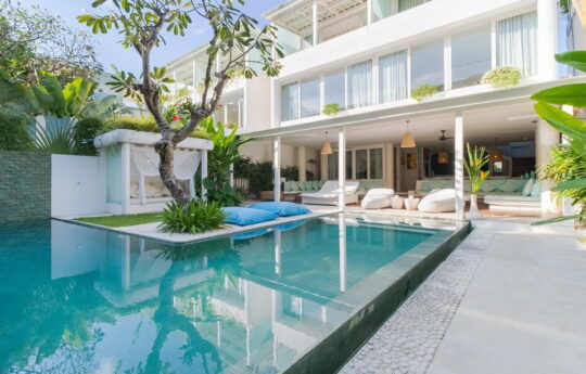 Outdoor swimming pool with views to villa interior