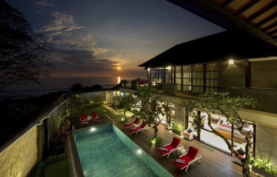 Sunset view from Master bedroom with view of pool with lights on