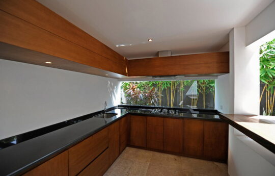 Kitchen in villa with black stone bench