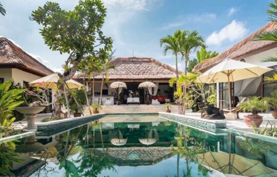 Villa Tibu Indah's swimming pool and outdoor area with villa exterior