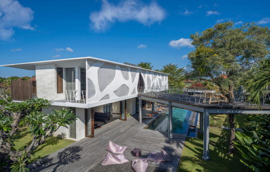 Exterior layout of the villa with pool views and deck area